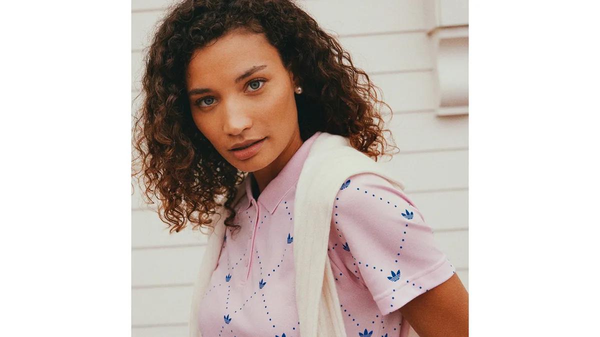 Woman in a pink adidas golf polo