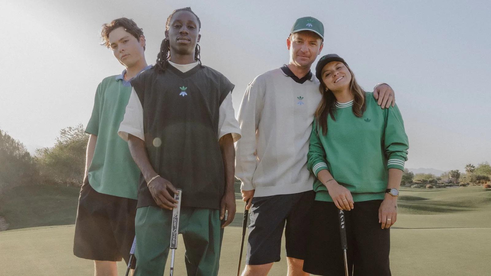 Four golfers in adidas polos on a fairway