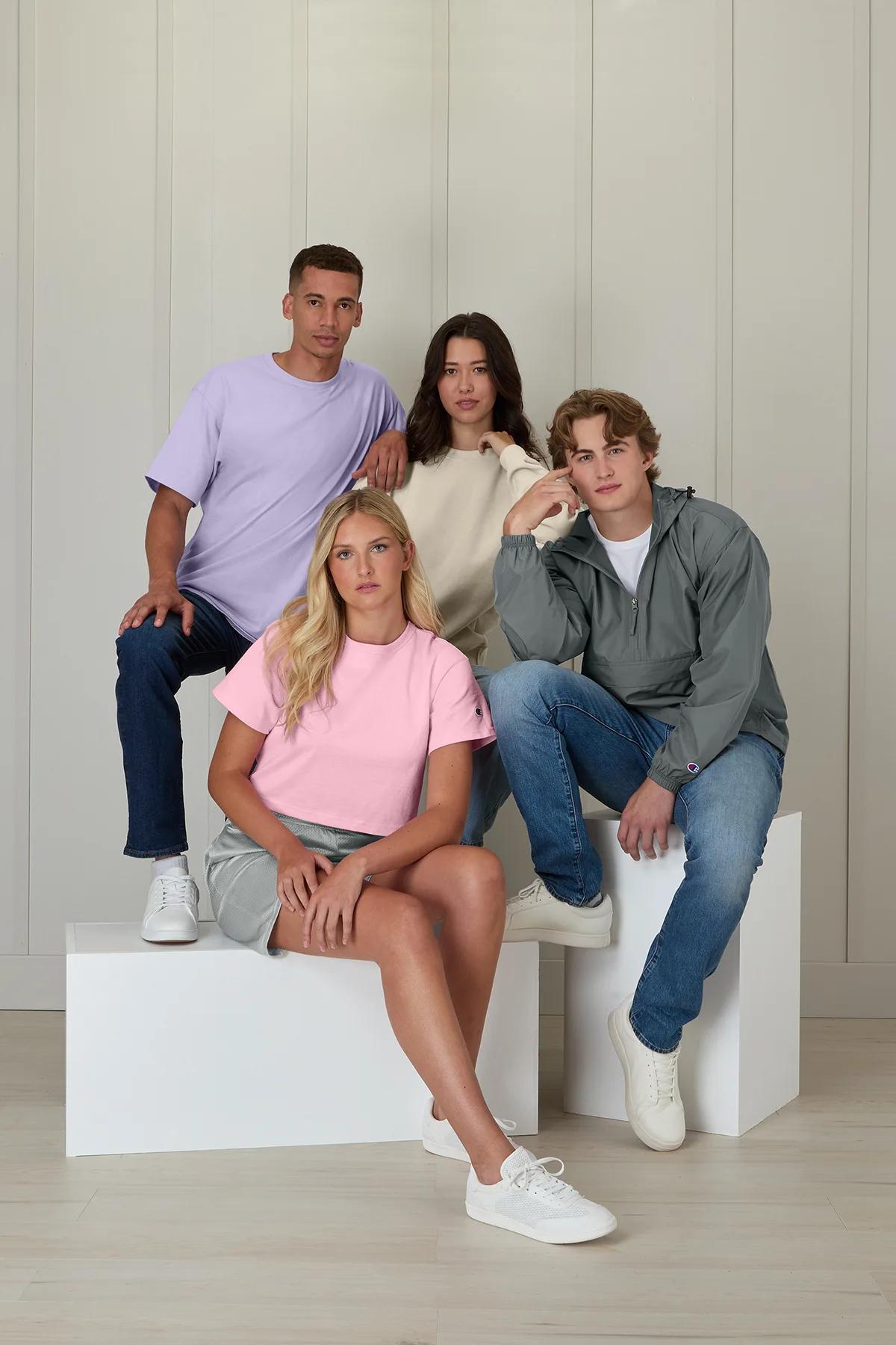 Four people in Champion tees and Powerblend crews in a studio