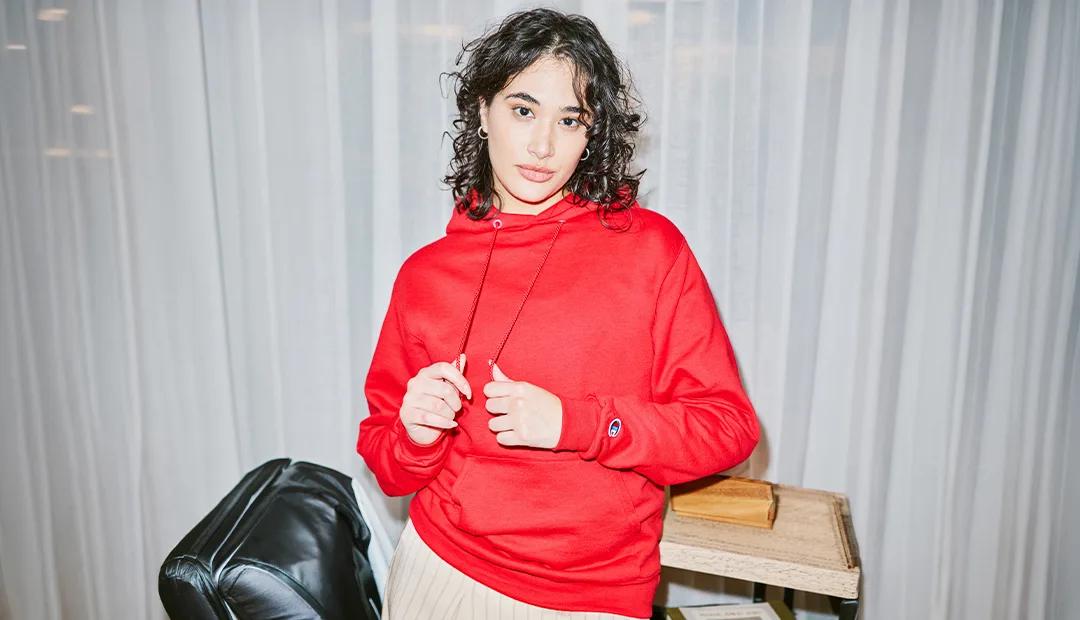 Woman wearing a red Champion hoodie